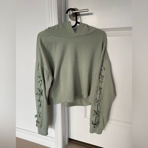 Rue21 Green distressed cropped hoodie with lace up long sleeves